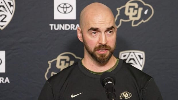 Sean Lewis at the podium at CU